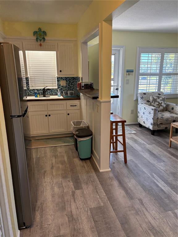 14531 Walsingham Road, Unit 225 Largo, FL 33774 - Photo 9 of 17 a kitchen with stainless steel appliances a refrigerator and a stove