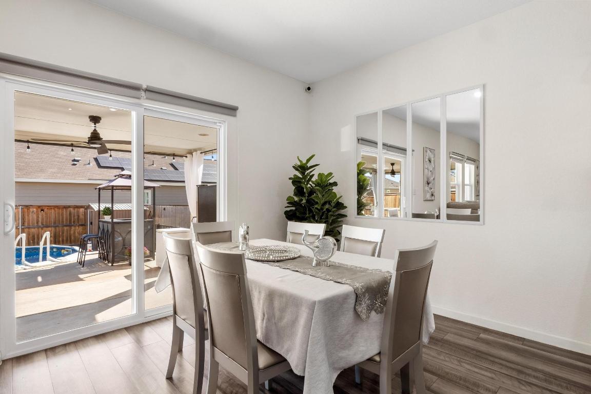 101 Magnum Force Drive Jarrell, TX 76537 - Photo 11 of 29 a view of a dining room with furniture and wooden floor