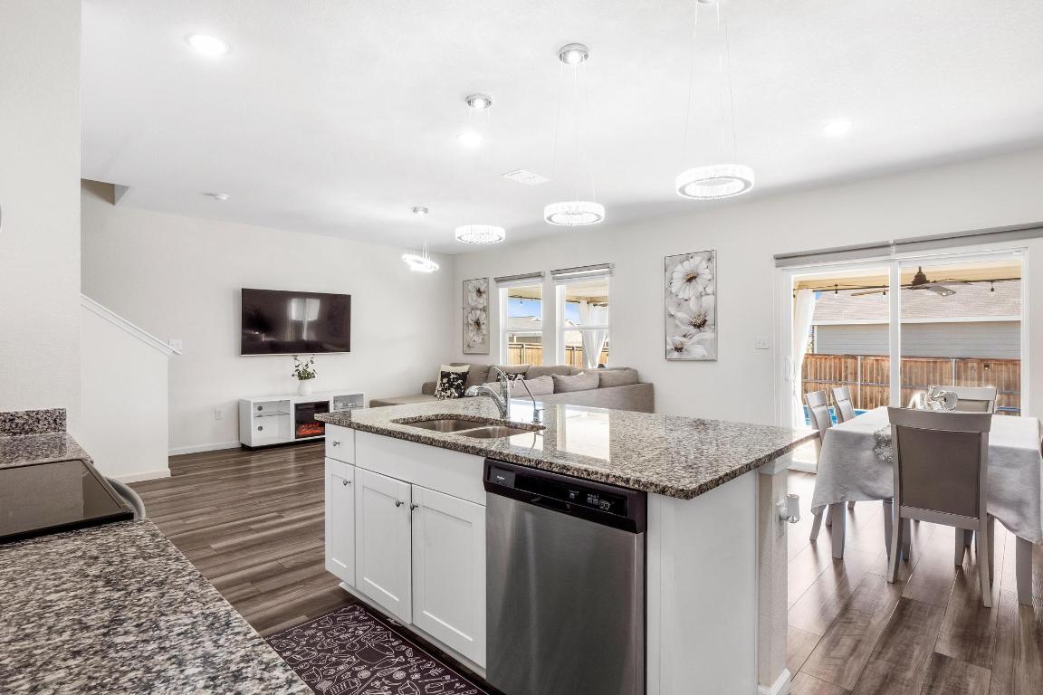 101 Magnum Force Drive Jarrell, TX 76537 - Photo 28 of 29 a kitchen with sink and view of living room