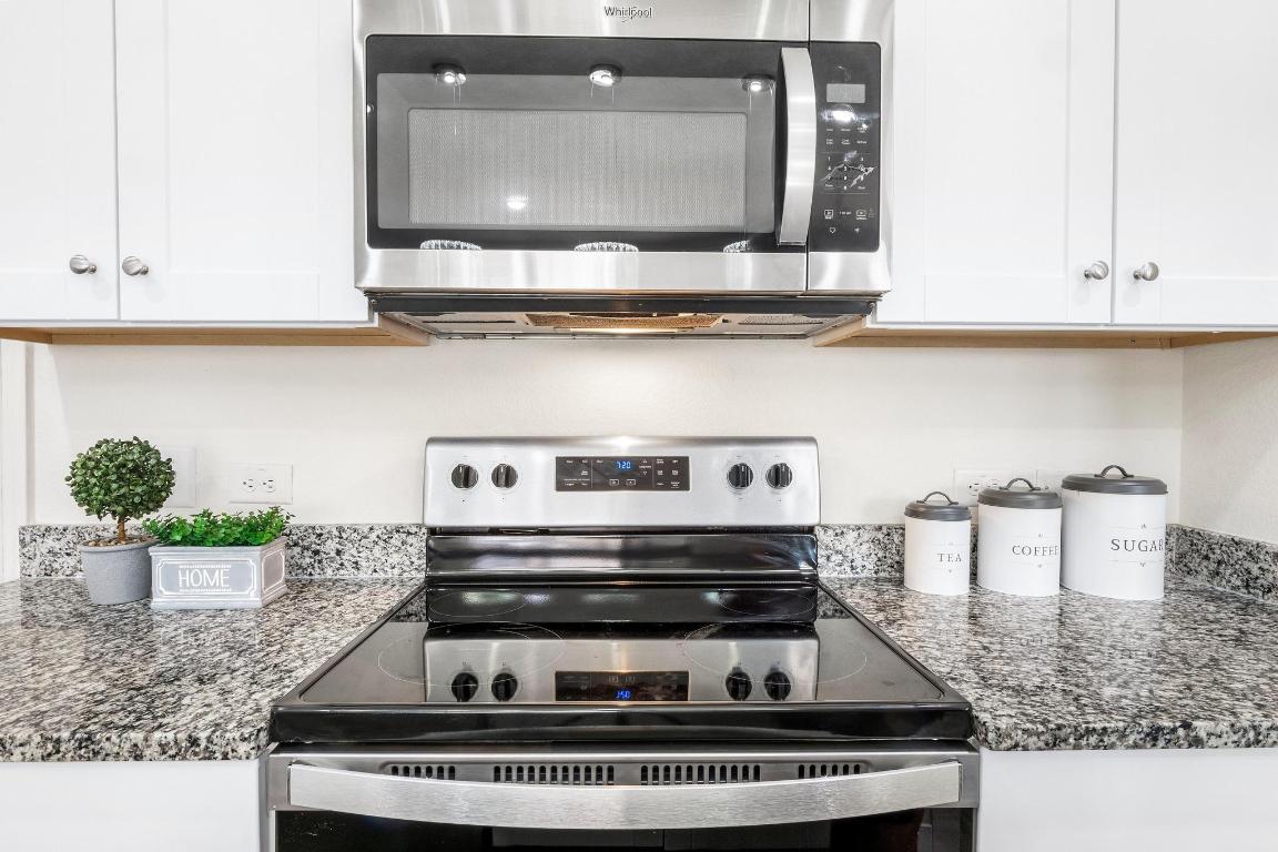 101 Magnum Force Drive Jarrell, TX 76537 - Photo 14 of 29 a stove top oven sitting inside of a kitchen