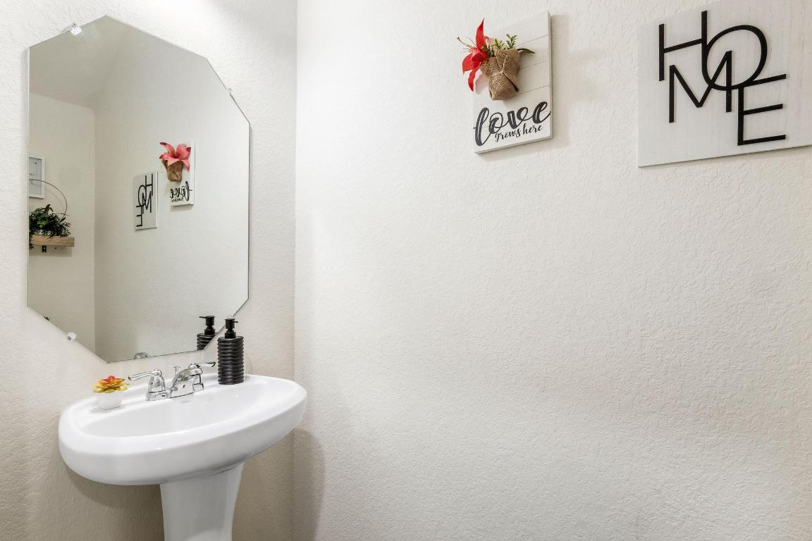 101 Magnum Force Drive Jarrell, TX 76537 - Photo 15 of 29 a bathroom with a sink and a mirror