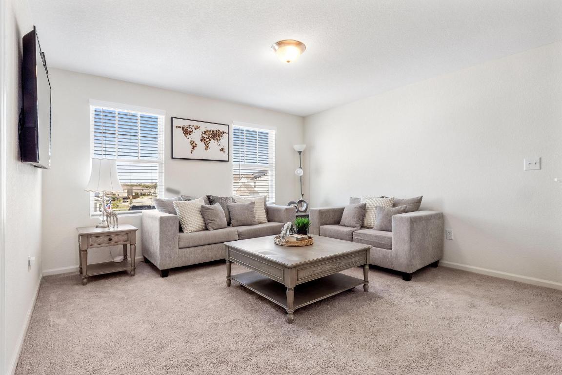 101 Magnum Force Drive Jarrell, TX 76537 - Photo 17 of 29 a living room with furniture and a large window