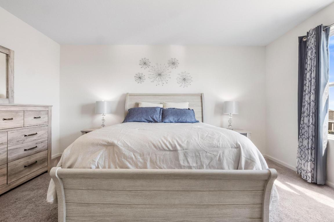 101 Magnum Force Drive Jarrell, TX 76537 - Photo 19 of 29 a bedroom with a bed and lamp