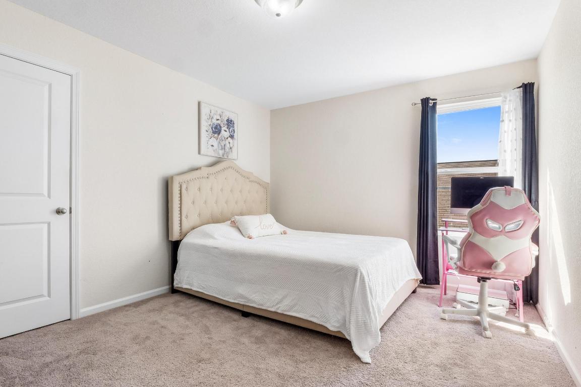 101 Magnum Force Drive Jarrell, TX 76537 - Photo 23 of 29 a bedroom with a bed and dresser