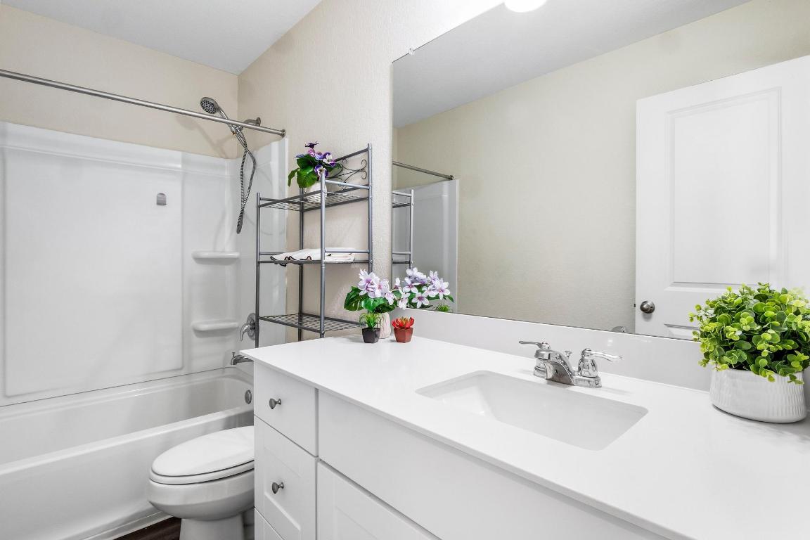 101 Magnum Force Drive Jarrell, TX 76537 - Photo 24 of 29 a bathroom with a sink toilet and shower