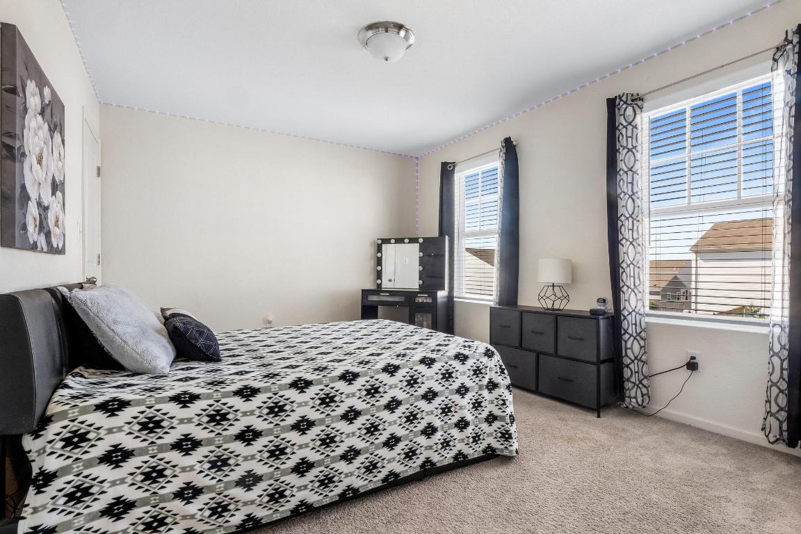 101 Magnum Force Drive Jarrell, TX 76537 - Photo 25 of 29 a bedroom with a bed and window