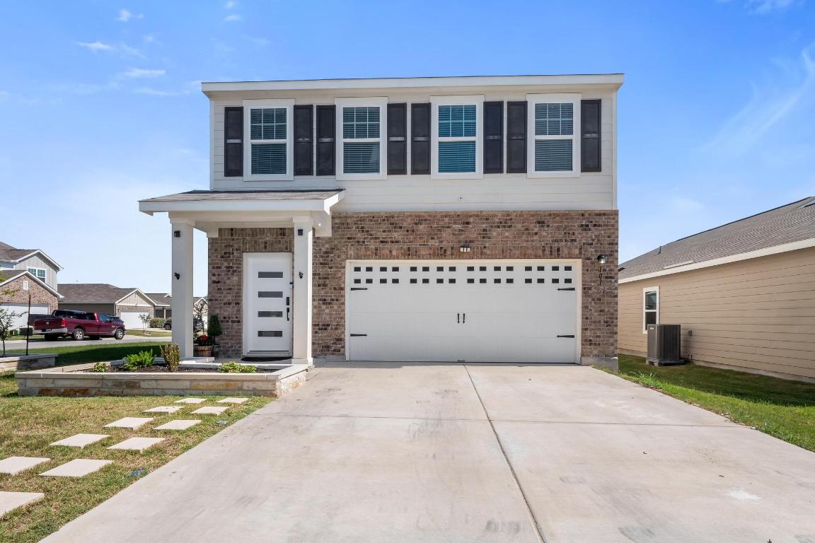101 Magnum Force Drive Jarrell, TX 76537 - Photo 27 of 29 a front view of a house with a yard
