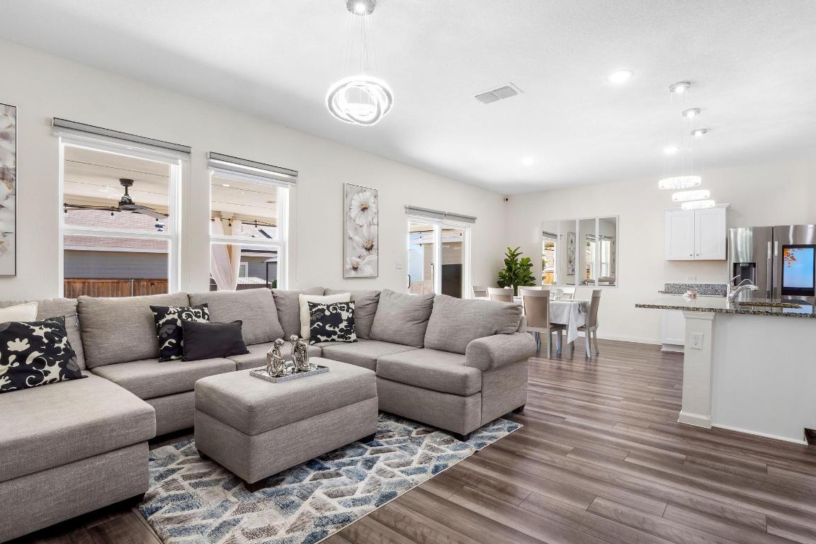 101 Magnum Force Drive Jarrell, TX 76537 - Photo 9 of 29 a living room with furniture and view of kitchen