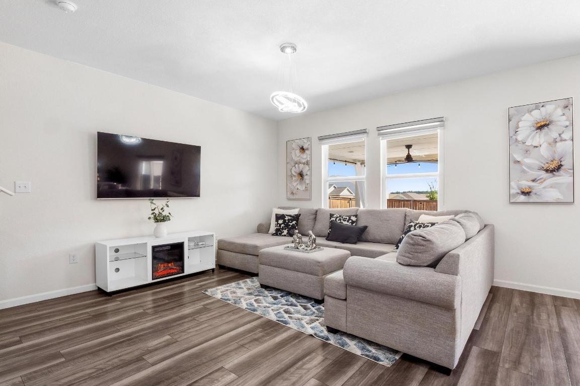 101 Magnum Force Drive Jarrell, TX 76537 - Photo 10 of 29 a living room with furniture and a flat screen tv