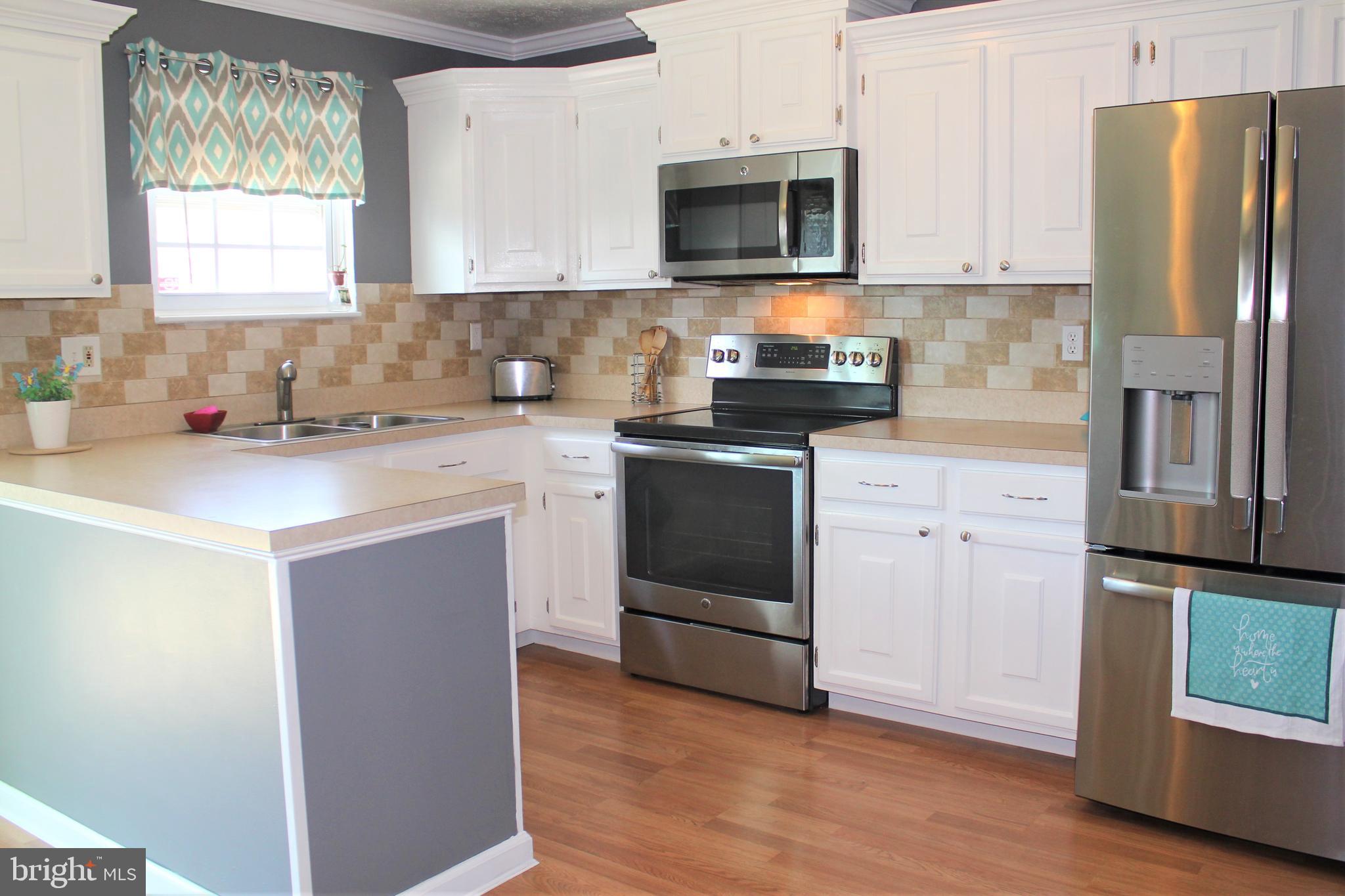 4072 Rustico Road Baltimore, MD 21220 - Photo 13 of 46 Stainless Steel Appliances and tile backsplash