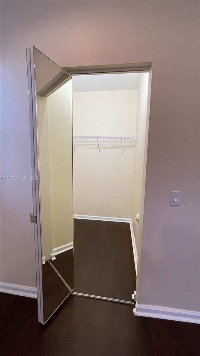 3123 Laurel Ridge Circle, Unit 3123 Riviera Beach, FL 33404 - Photo 13 of 18 an empty room with wooden floor
