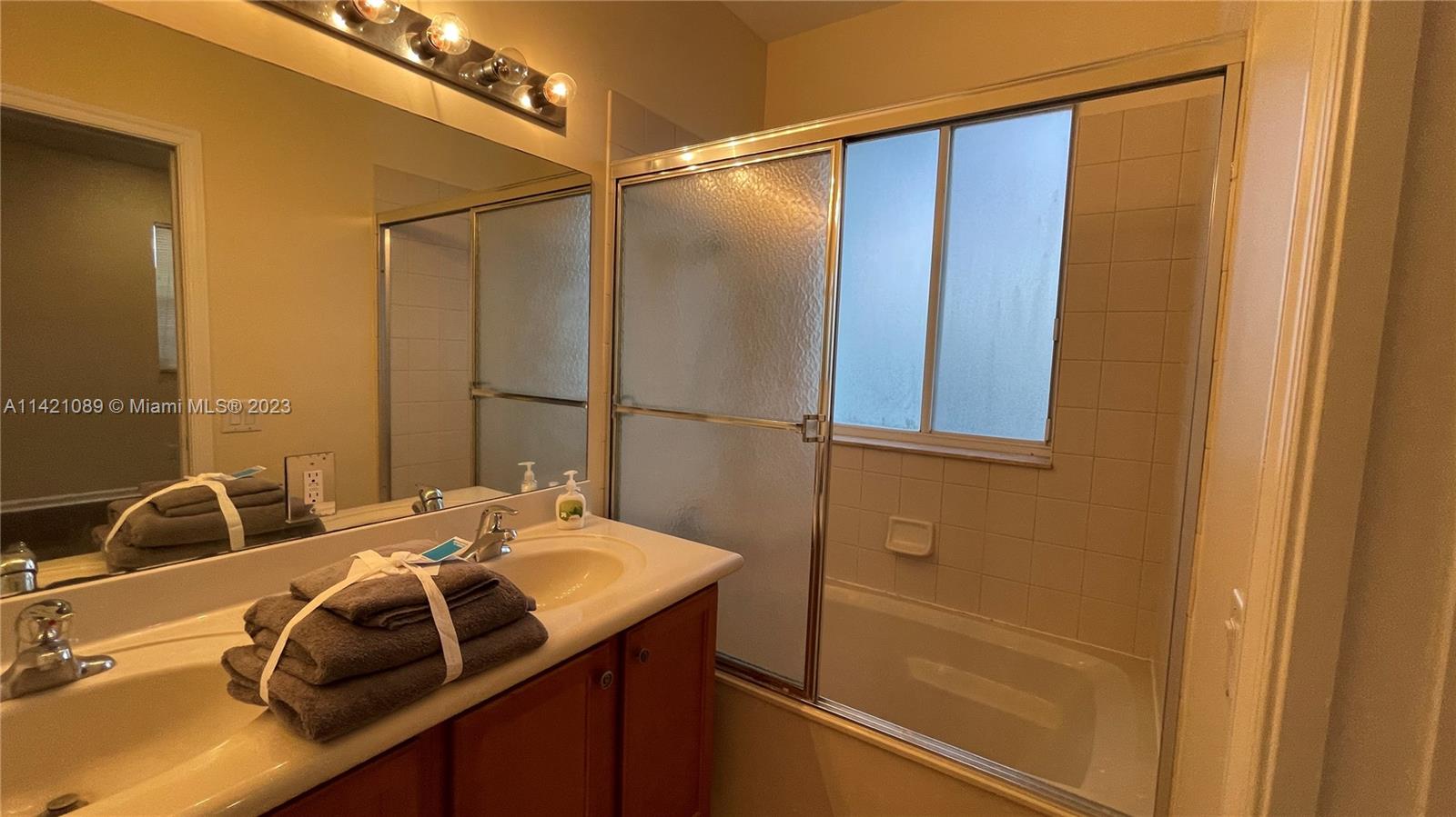 3123 Laurel Ridge Circle, Unit 3123 Riviera Beach, FL 33404 - Photo 10 of 18 a bathroom with a sink and a mirror