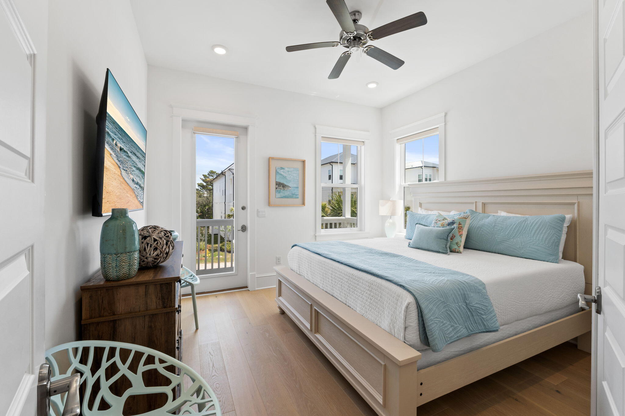 80 Seaboard Lane Santa Rosa Beach, FL 32459 - Photo 41 of 88 a bedroom with a bed and wooden floor