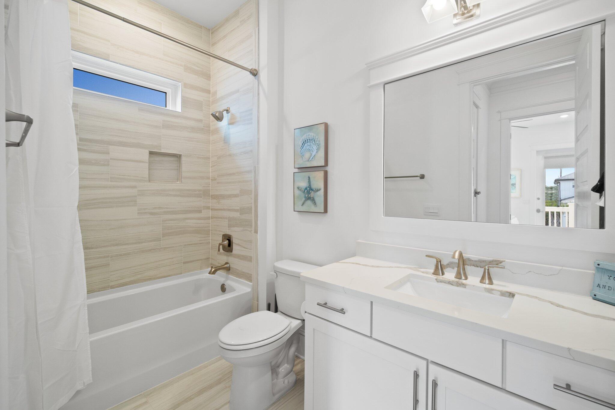 80 Seaboard Lane Santa Rosa Beach, FL 32459 - Photo 60 of 88 a bathroom with a sink a toilet and shower