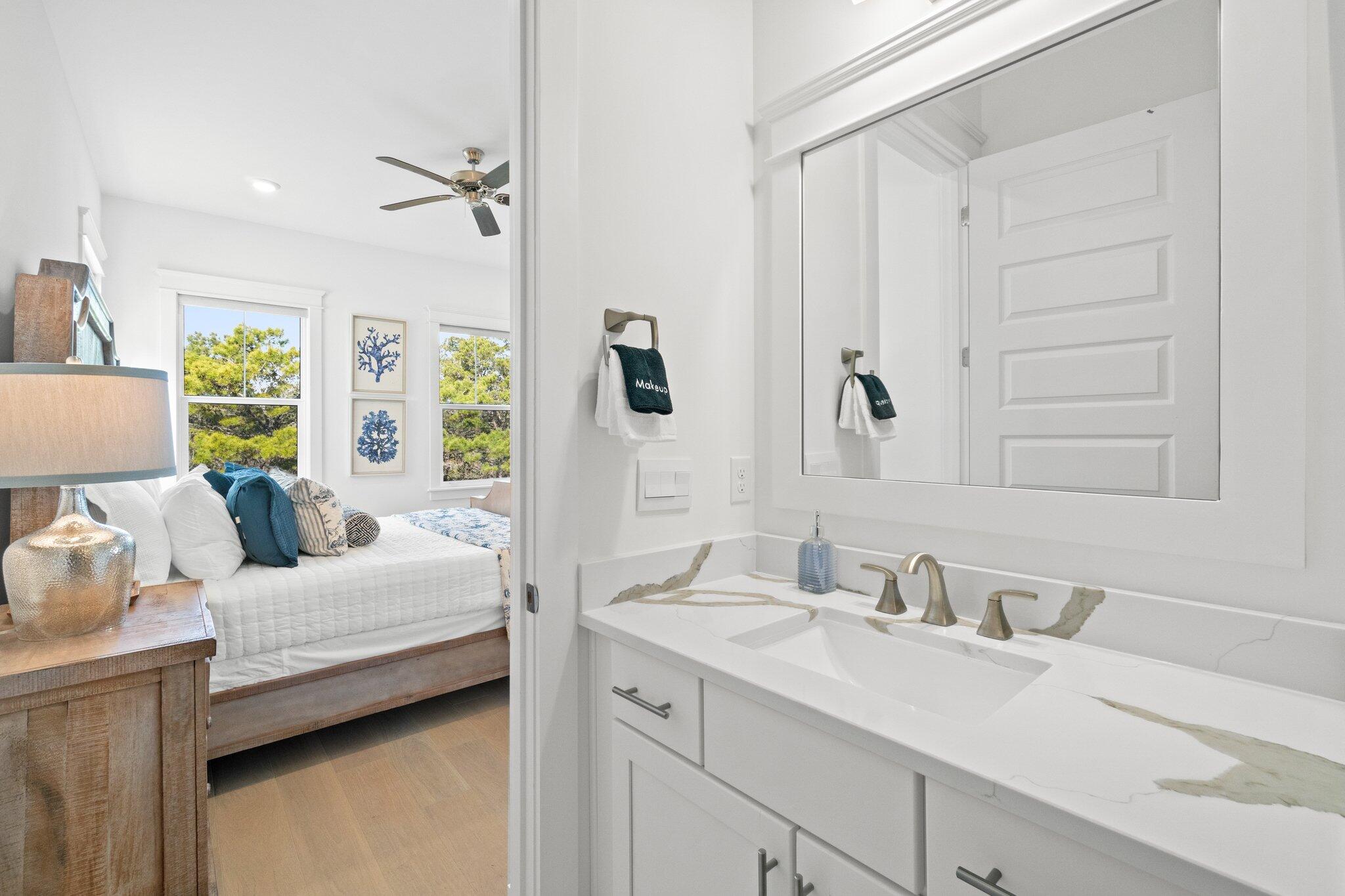 80 Seaboard Lane Santa Rosa Beach, FL 32459 - Photo 65 of 88 a en suite bathroom with a double vanity sink and mirror