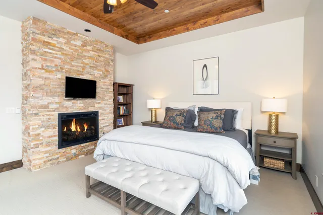 a bed room with a bed and a fireplace