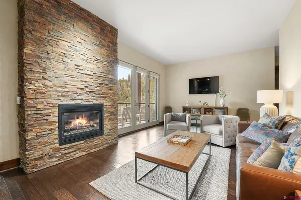 a living room with furniture and a flat screen tv
