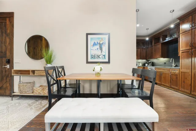 a large kitchen with stainless steel appliances granite countertop a refrigerator and a stove top oven