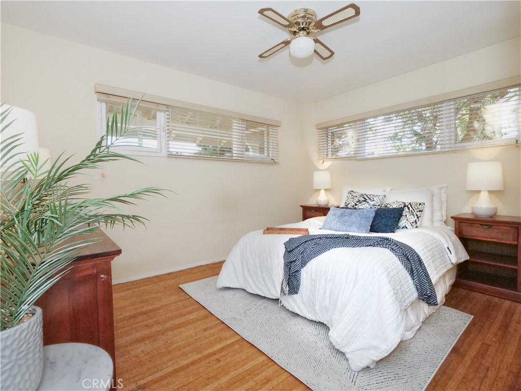 156 Vía Los Altos Redondo Beach, CA 90277 - Photo 13 of 25 a bedroom with a bed and wooden floor