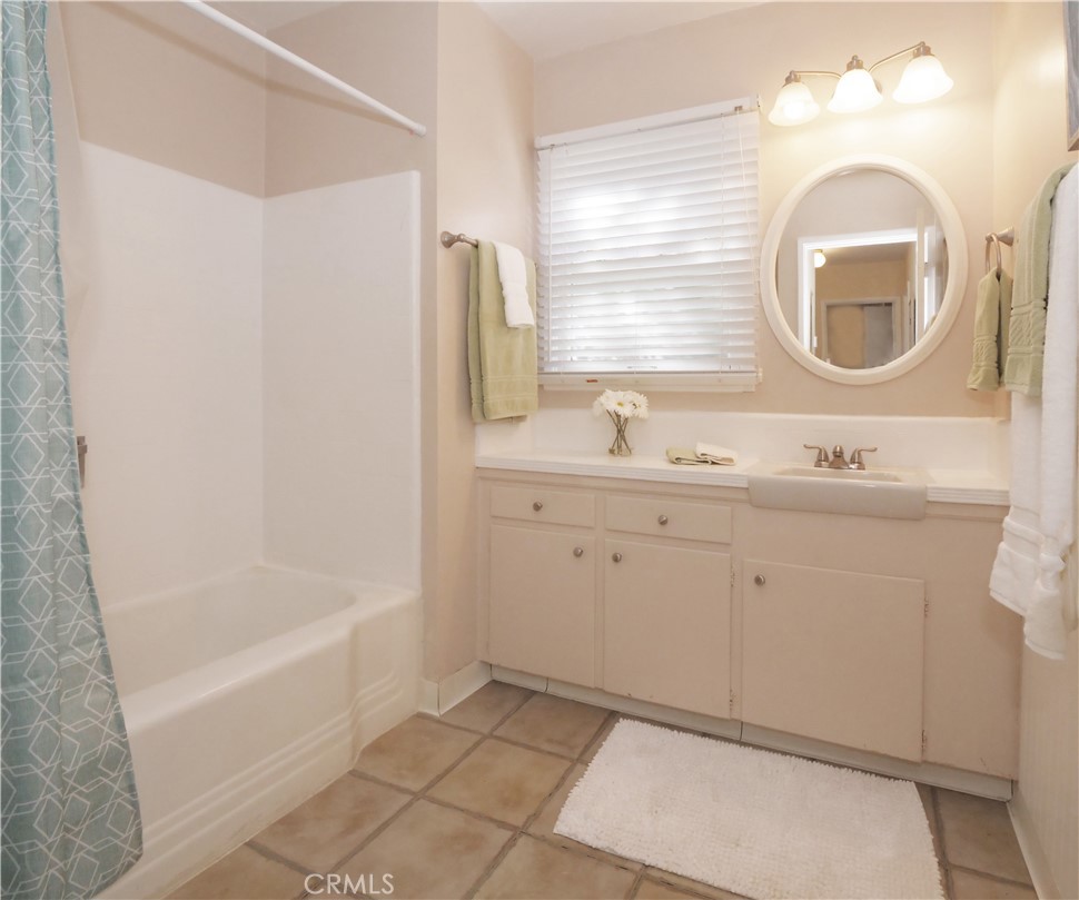 156 Vía Los Altos Redondo Beach, CA 90277 - Photo 14 of 25 a bathroom with a sink mirror vanity and bathtub