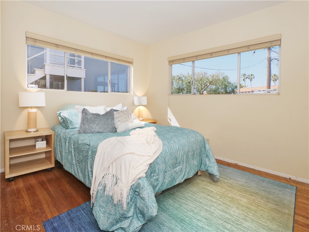 156 Vía Los Altos Redondo Beach, CA 90277 - Photo 15 of 25 a bedroom with a bed and a large window