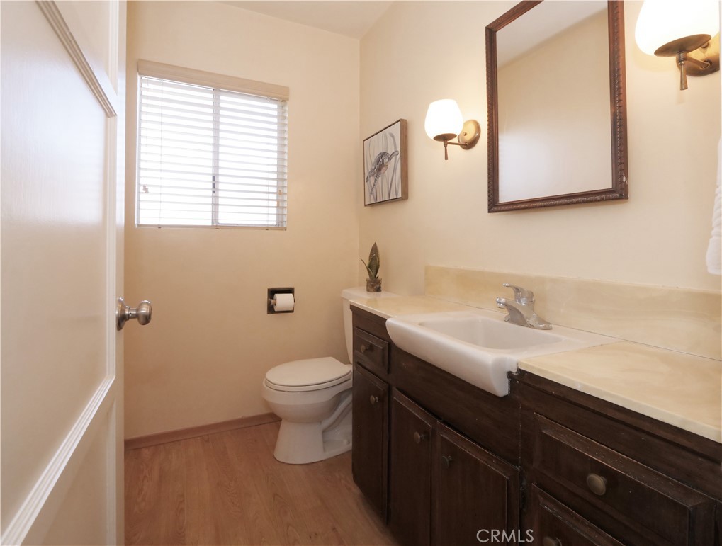 156 Vía Los Altos Redondo Beach, CA 90277 - Photo 16 of 25 a bathroom with a sink a toilet and mirror