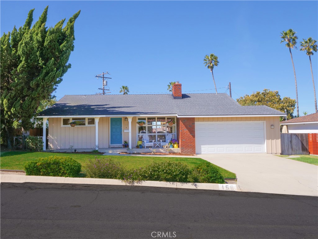 156 Vía Los Altos Redondo Beach, CA 90277 - Photo 24 of 25 a front view of a house with a yard and potted plants
