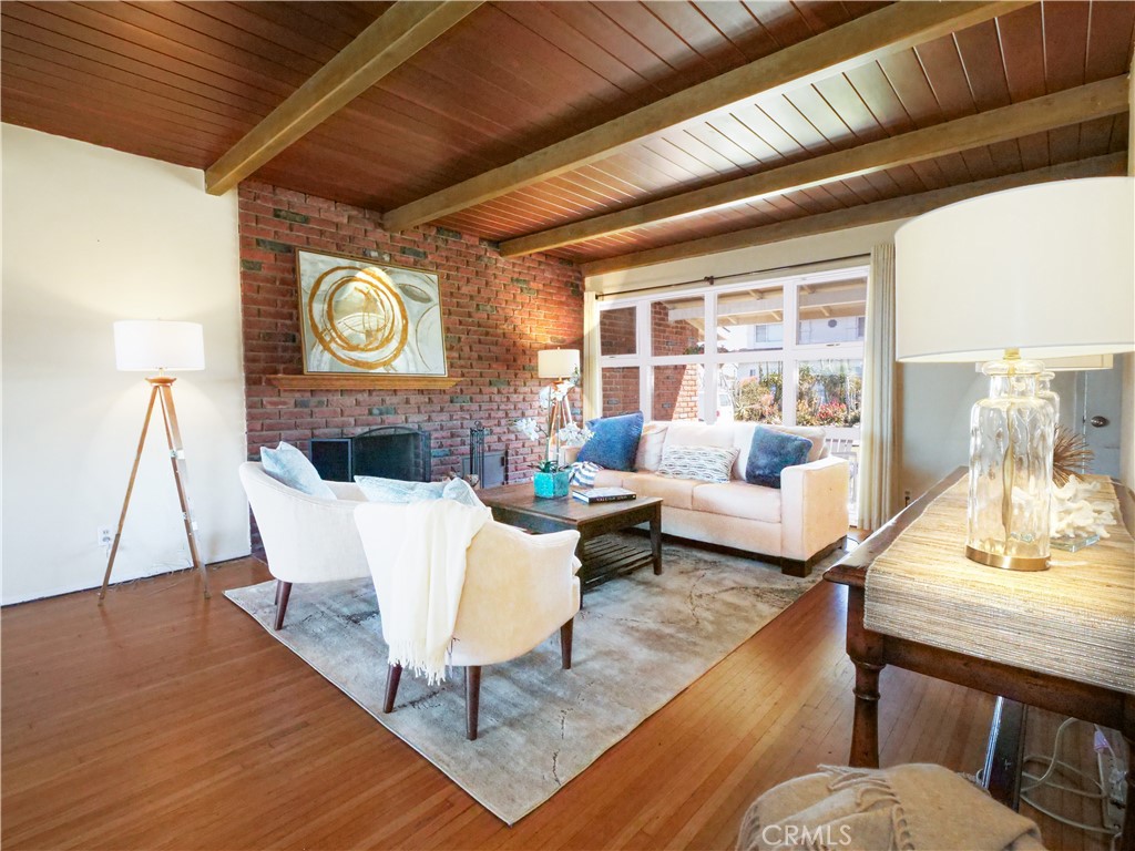 156 Vía Los Altos Redondo Beach, CA 90277 - Photo 3 of 25 a living room with furniture and a wooden floor