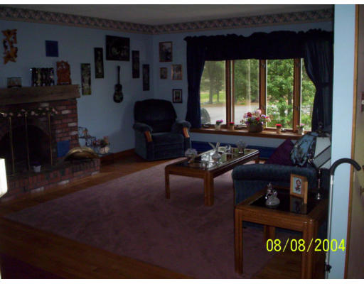 207 Sherbert Road Ashburnham, MA 01430 - Photo 2 of 7 a living room with furniture and a floor to ceiling window