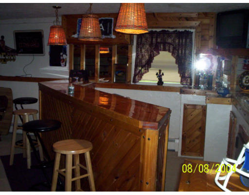 207 Sherbert Road Ashburnham, MA 01430 - Photo 3 of 7 a view of a dining room with furniture and a chandelier
