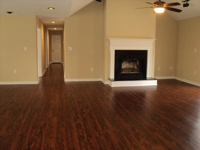 169 Pea Ridge Road Juliette, GA 31046 - Photo 11 of 12 a view of an empty room with wooden floor and a fireplace