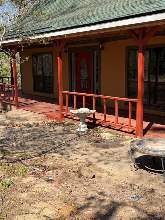 263 Highway 154 Ringgold, LA 71068 - Photo 2 of 38 Back of house featuring roof with shingles
