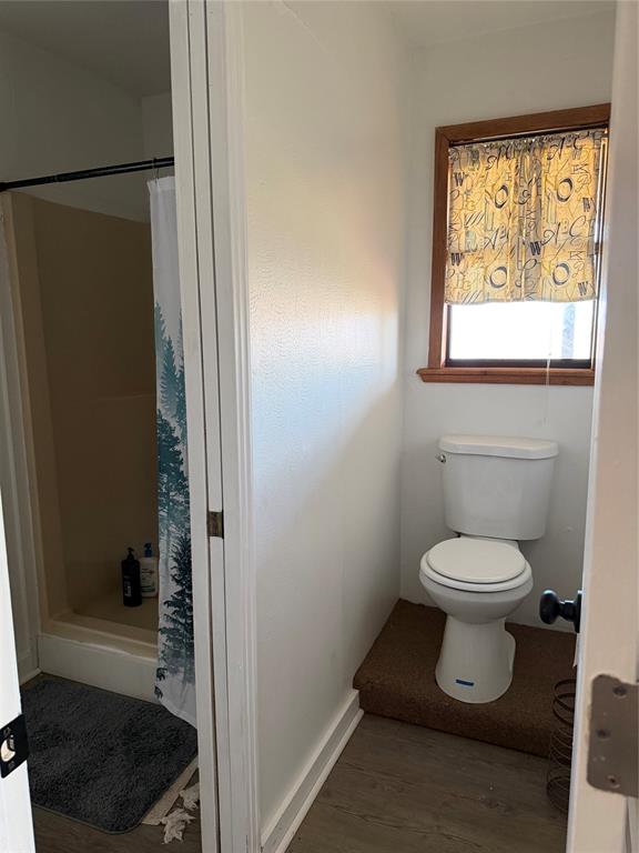 263 Highway 154 Ringgold, LA 71068 - Photo 25 of 38 Full bathroom with a stall shower and light wood-style floors