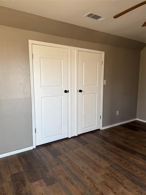 263 Highway 154 Ringgold, LA 71068 - Photo 27 of 38 Unfurnished bedroom with dark wood finished floors and ceiling fan