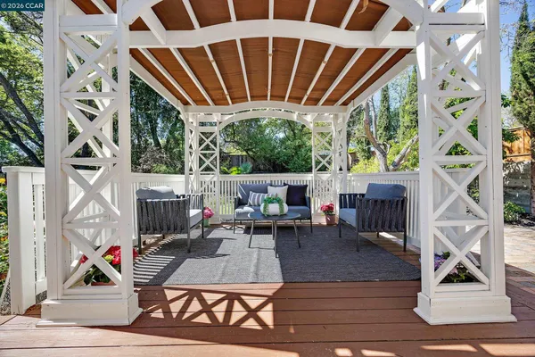 a view of living room filled with furniture and rug floor