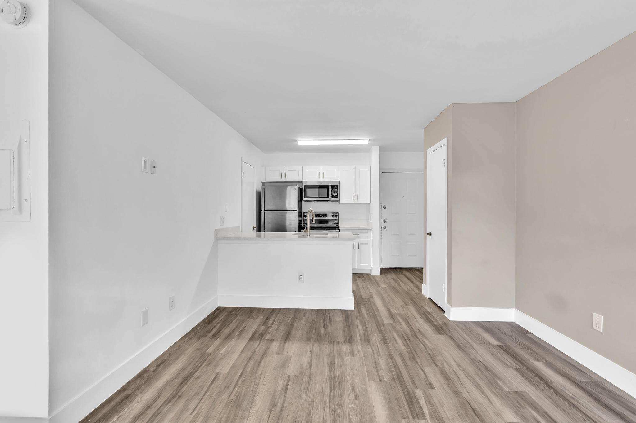 4481 West McNab Road, Unit 28 Pompano Beach, FL 33069 - Photo 17 of 45 a view of a kitchen with wooden floor and a sink