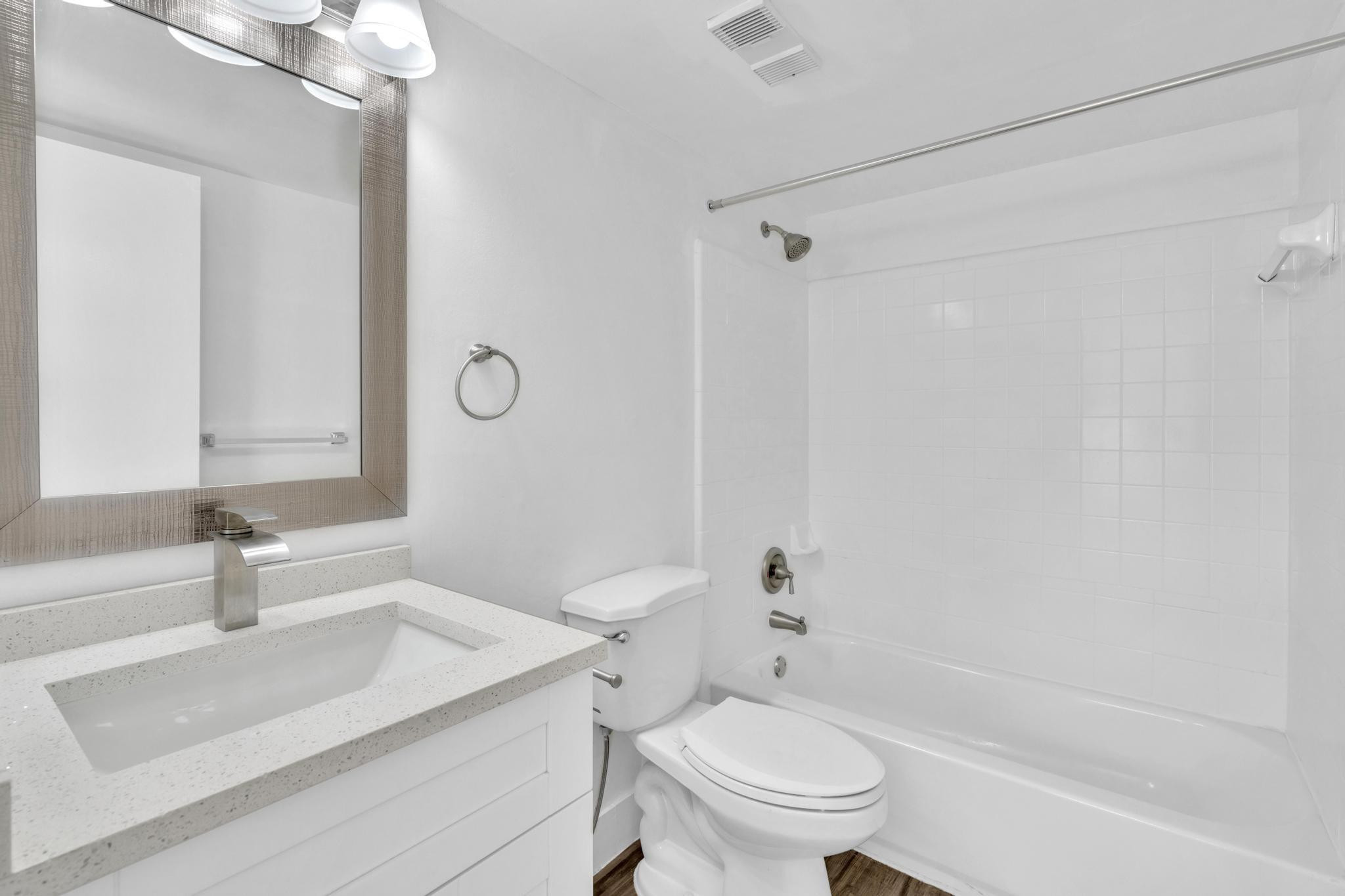 4481 West McNab Road, Unit 28 Pompano Beach, FL 33069 - Photo 23 of 45 a bathroom with a sink toilet vanity and shower