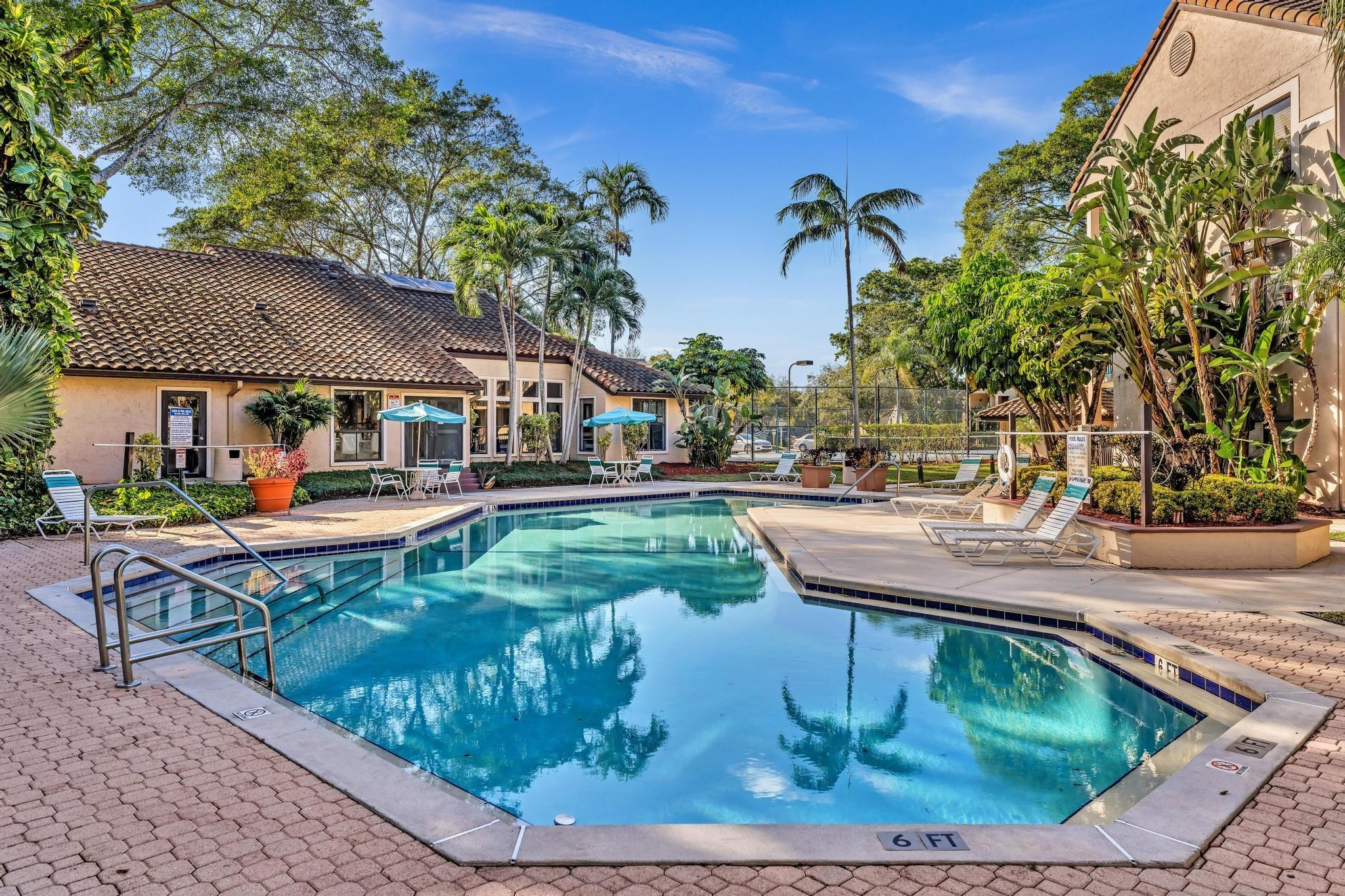 4481 West McNab Road, Unit 28 Pompano Beach, FL 33069 - Photo 29 of 45 swimming pool view with a seating space