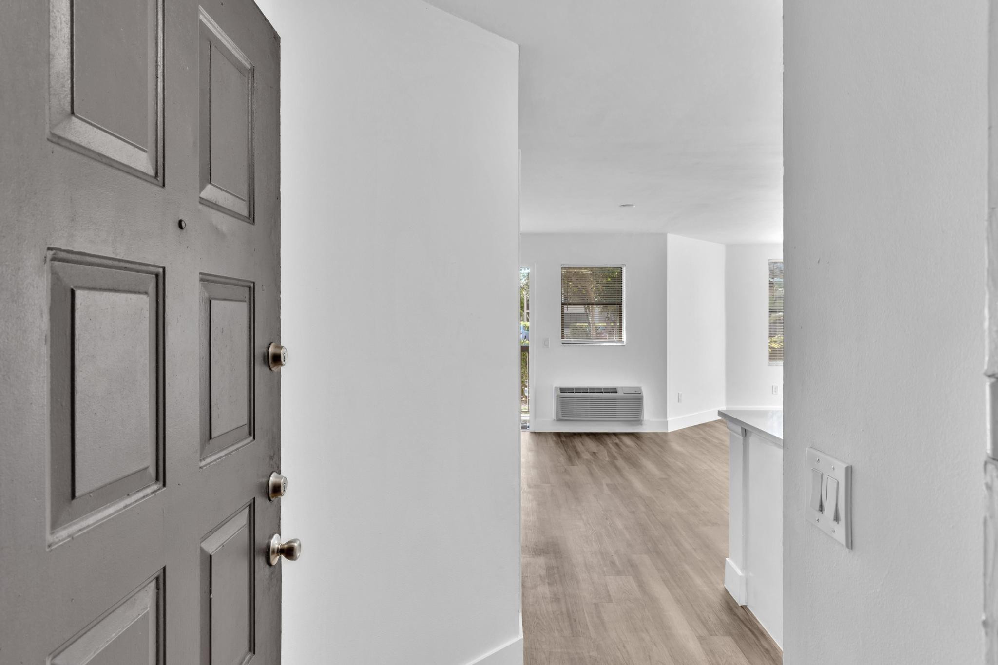 4481 West McNab Road, Unit 28 Pompano Beach, FL 33069 - Photo 3 of 45 a view of empty room with wooden floor