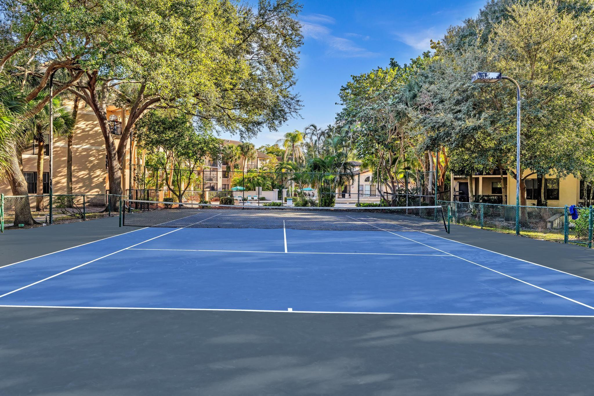 4481 West McNab Road, Unit 28 Pompano Beach, FL 33069 - Photo 36 of 45 a view of a tennis court