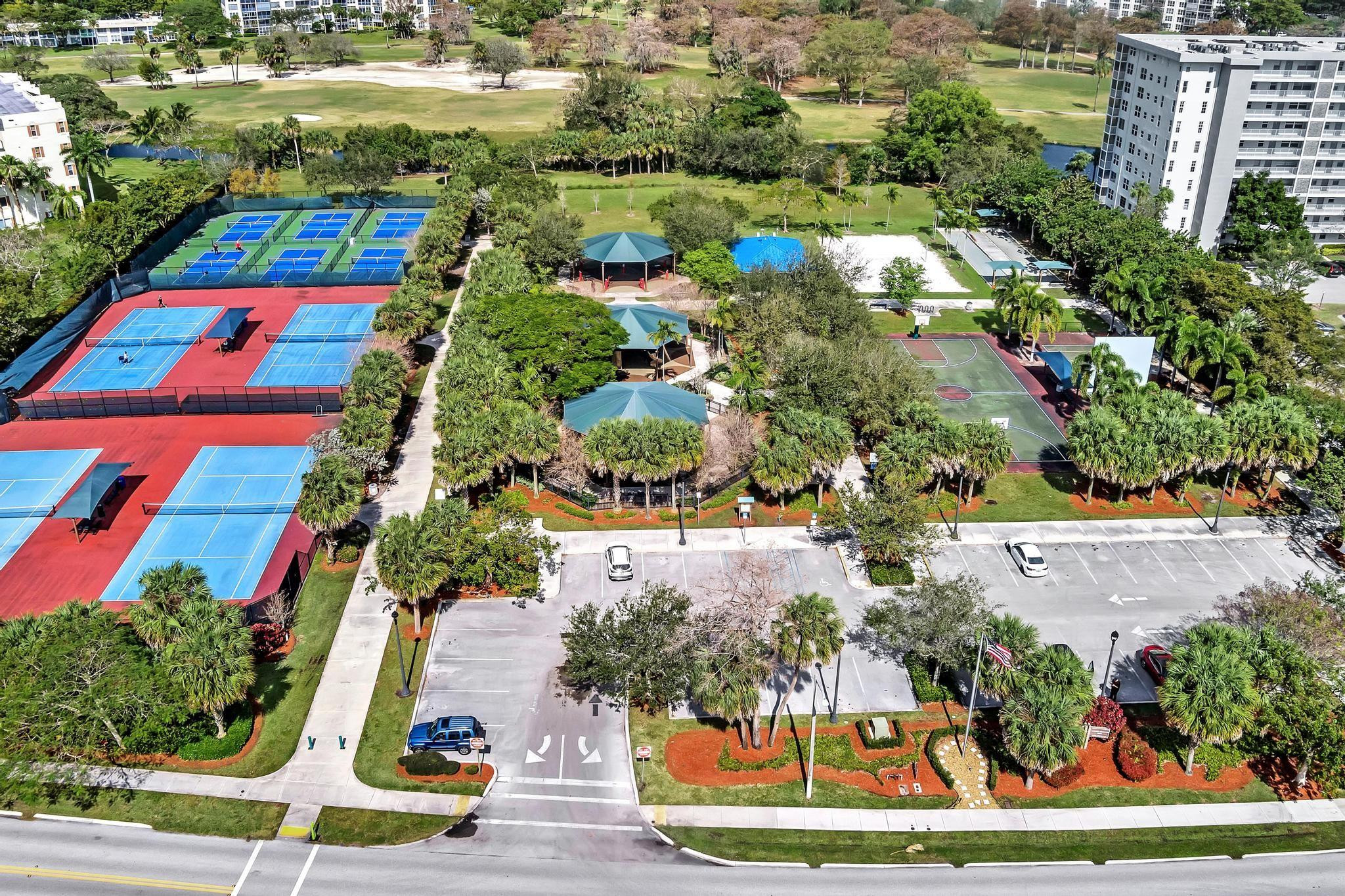 4481 West McNab Road, Unit 28 Pompano Beach, FL 33069 - Photo 41 of 45 an aerial view of houses with yard