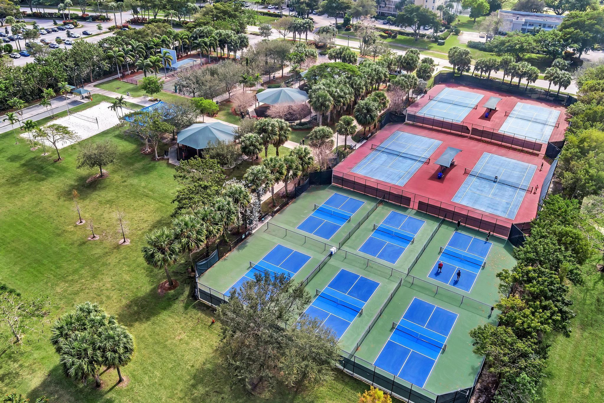 4481 West McNab Road, Unit 28 Pompano Beach, FL 33069 - Photo 42 of 45 an aerial view of a houses with yard
