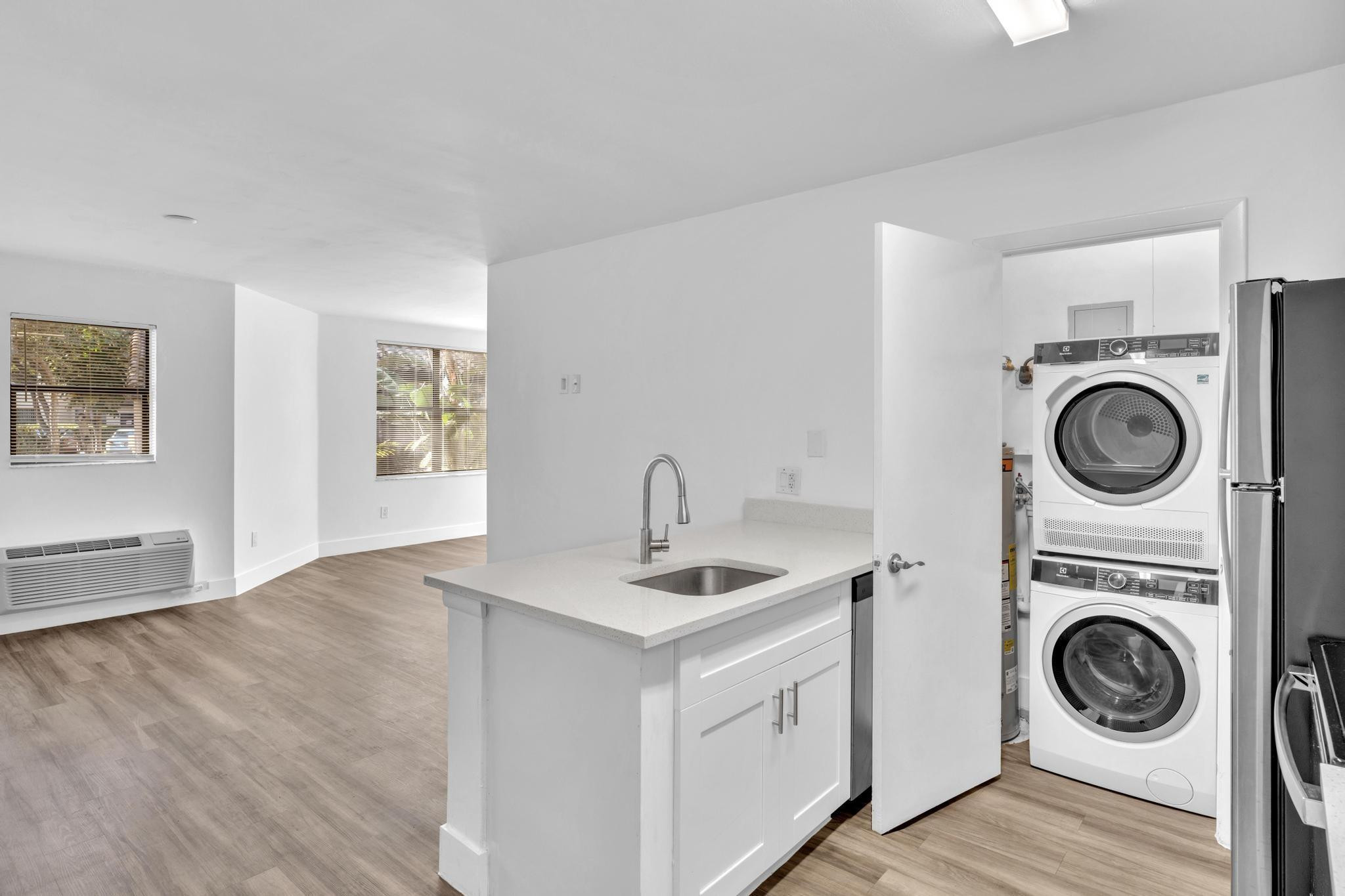 4481 West McNab Road, Unit 28 Pompano Beach, FL 33069 - Photo 5 of 45 a view of a hallway with washer and dryer