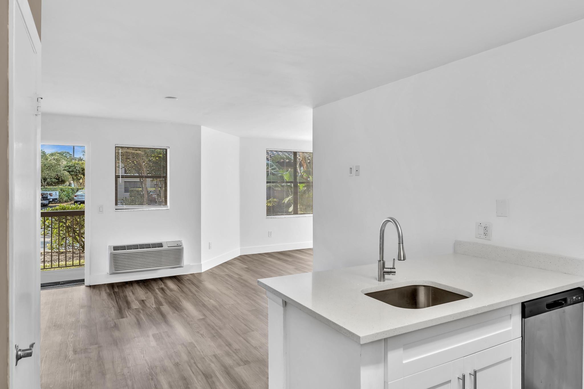 4481 West McNab Road, Unit 28 Pompano Beach, FL 33069 - Photo 8 of 45 a kitchen with a sink and a refrigerator