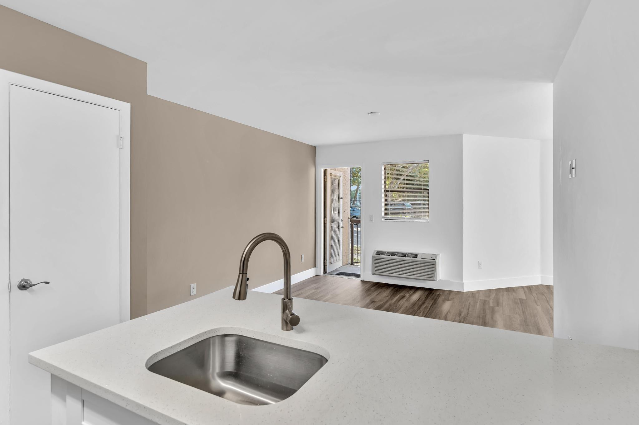 4481 West McNab Road, Unit 28 Pompano Beach, FL 33069 - Photo 9 of 45 a kitchen with a sink and a refrigerator