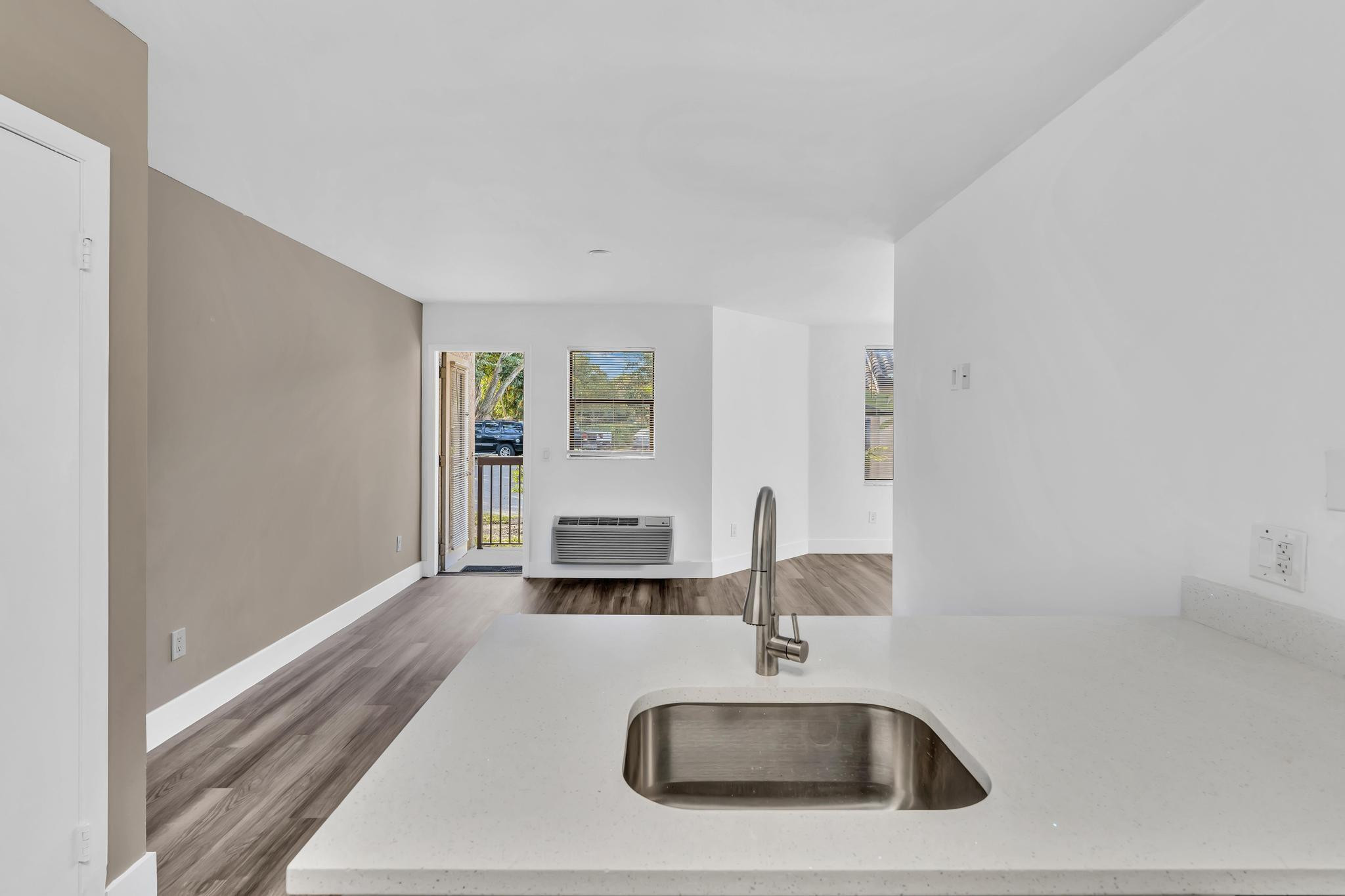 4481 West McNab Road, Unit 28 Pompano Beach, FL 33069 - Photo 10 of 45 a kitchen with a sink and a window