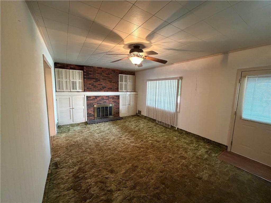 1041 4th Street Monongahela, PA 15063 - Photo 18 of 28 en empty room with windows and fireplace