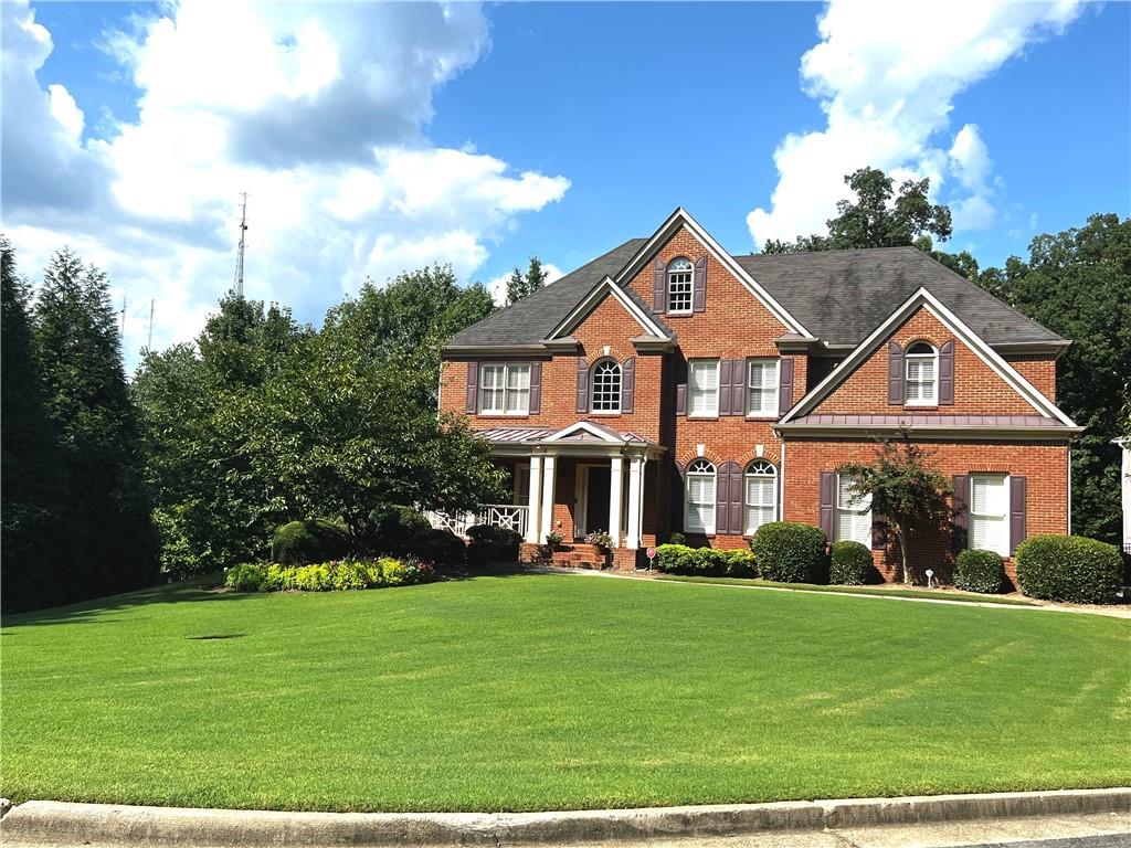 155 Trowbridge Road Sandy Springs, GA 30350 - Photo 1 of 1 a front view of a house with a garden