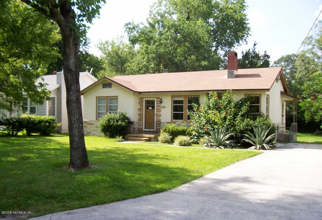 4609 Sunderland Road Jacksonville, FL 32210 - Photo 1 of 7 a view of a house with a yard and plants