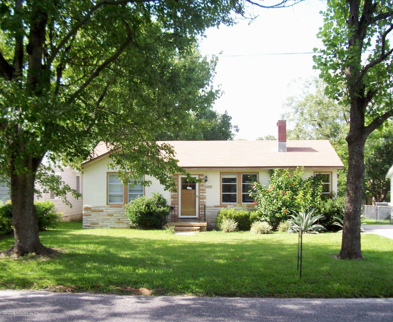 4609 Sunderland Road Jacksonville, FL 32210 - Photo 2 of 7 a front view of a house with a garden